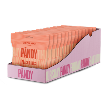 Displayboks med orange Pandy Candy Sweet Peach poser, teksten viser "1g OF SUGAR".